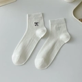 White cotton ballet style socks with black bow embroidery and fine ribbed texture - One Size / Milk White
