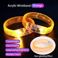 Orange acrylic LED bracelet with internal air bubbles and glowing effect on black background - Large Wide Bracelet / Orange
