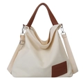 Fashionable off-white canvas tote bag with brown leather handles and adjustable shoulder strap - Off White