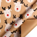 Brown kraft Christmas wrapping paper roll featuring cute red-nosed reindeer patterns - Cute Reindeer Head