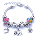 Silver charm bracelet with snake chain features colorful beads and hollow heart elephant pendants - Yellow