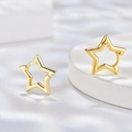 Minimalist gold star hoop earrings featuring a hollow cutout geometric design - Gold