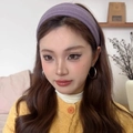 Chic purple knitted velvet headband for women with a pleated spiral texture on a model - Taro Purple