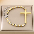 Detail of two-tone beaded stainless steel bracelet with a gold cross and lobster clasp - Gold Cross Beaded Style (KB106036-K)