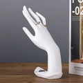 Matte white hand-shaped resin jewelry holder for displaying rings and bracelets - Lotus Pose Hand