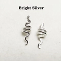 Close-up of bright silver dreadlock ring with a hollow snake design for DIY hair styling - Bright Silver
