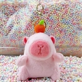 Pink plush capybara doll keychain with orange fruit decor and gold lobster clasp - Pink Orange Style + Gold Clip