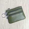 Green leather coin purse with three zippers and a silver keychain on wooden desk - Army Green