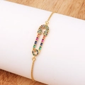 Detail of gold safety pin bracelet with multi-colored cubic zirconia stones and adjustable clasp - Safety Pin Style (款式八)