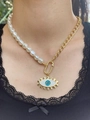 Close-up of 18k gold-plated Evil Eye necklace with white pearls on a model - Asymmetric Pearl Splicing Evil Eye Necklace / Gold+White+Blue