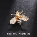 Golden bee brooch with sparkling rhinestones and a central faux pearl accent - Gold Pearl Rhinestone Bee