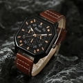 Detail view of square black dial watch with rose gold hands on dark rock surface - HK064 Watch Only / Brown