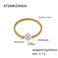 Detail of gold stainless steel ring with white shell bead and small rhinestones - US 6 / Gold Zirconia Shell Pearl