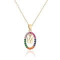 Macro shot of gold letter W pendant featuring rainbow zircons on a delicate chain - Letter W