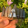 Handmade smoky crystal hair comb with silver crow skull charms in sunlight - Smoky Quartz + Silver Crow Skull