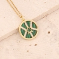 Gold necklace with green malachite pendant and star design on a stone surface - Green (Malachite Texture)