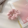 Pink sheer mesh hair scrunchie with daisy print on a notebook background - Small / Small—Pink