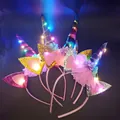 Detail of LED unicorn headband with sequin ears and colorful flowers for party glow - LED Unicorn Rainbow Horn