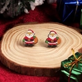 Cute cartoon Santa Claus stud earrings on a wooden slice with festive holiday decor - Round Santa Claus