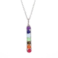 Macro view of handmade wire wrapped chakra pendant with seven colorful gemstone beads - Silver Tone + Chakra Multicolor Beads