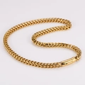 Close-up of golden stainless steel wheat chain necklace with rectangular clasp - Round Clasp / 8mm