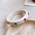 Macro shot of marble resin bangle with multicolored crystals and gold-plated edges - 37# Bangle-White-Colorful-Round