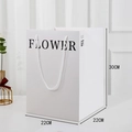Detailed view of white gift bag with dimensions 22cm x 22cm x 30cm and flower gift text - FLOWER-White/Black / 22x22x30cm