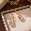 Detail of teardrop glass earrings with purple dried flowers and gold metal hooks - Pear Shape Pendant / Purple