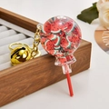 Lollipop keychain with red watermelon slices and golden bell on wooden tray - Fruit Lollipop [Watermelon Red]