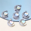 Macro shot of silver crescent moon heart pendant with sparkling colorful gemstone - Style 9-Moon Hugging Heart Silver