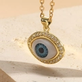 Goldene Halskette mit blauem Evil-Eye-Anhänger und Zirkonia auf Naturstein - XL2156-1 Weißer Zirkonia