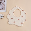 Detail of 6-layer muslin cotton baby bib with brown rainbow prints and snap buttons - Rainbow