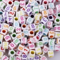 Macro shot of assorted square acrylic beads with colorful numbers for DIY jewelry making - 6x6mm White With Colored Numbers (100pcs)