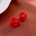 Elegant red rose stud earrings in shiny resin finish on a silk background - Red Rose