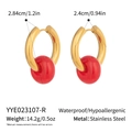 Macro detail of waterproof stainless steel gold hoops with red sphere pendant - Red (YYE023107-R)