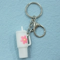 Cartoon white milk tea cup PVC keychain with pink flower and silver lobster clasp detail - Keychain / White Flower Cup Keychain