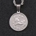 Silver Capricorn zodiac coin necklace in embossed stainless steel on black surface - Capricorn / Steel