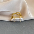 Detail of a four-prong set baroque pearl on a gold adjustable open ring band - Long Irregular Pearl Style (1# Ring-Gold)