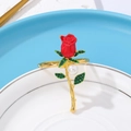 Golden alloy napkin ring with red rose design, green crystals, and white pearl detail - Z1128-3 (Red Rose White Pearl)