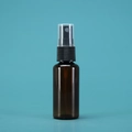 Travel-size amber glass spray bottle with black plastic nozzle and transparent cap - 30ml / Black Bottle Black Spray