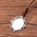Antique silver oval pendant base with beads and a brown braided rope for DIY necklaces - Beaded Openwork Oval Style