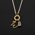 14K gold plated stainless steel letter W necklace with pink crystal pendant detail - Letter W