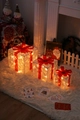 Three-piece set of illuminated transparent Christmas gift boxes with warm LED lights and red bows - 3D Bullseye Christmas Gift Box