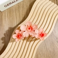 Pink gradient resin hair claw clip with three frangipani flowers on a wooden stand - Triple Five-Petal Flowers / Watermelon red
