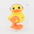 Dettaglio di papera a molla gialla con cuffie viola, dimensioni 8,5 cm per 6 cm - Anatra