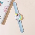 Detailed view of light blue silicone slap watch with a 3D rainbow unicorn on the dial - Light Blue
