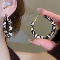 Detail of large hoop earrings featuring a black and white leopard pattern woven texture - 45# 925 Sterling Silver Earring Post - Brown - Round 4mm