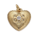 Macro shot of gold heart pendant featuring radial texture and a clear zircon center - Radial Texture Heart