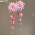Detail view of pink chiffon flower earrings with metallic tassel and crystal pendants - Pink