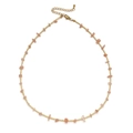 Bohemian style necklace with gold beads and irregular pink gravel stones on white background - Pink